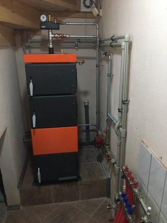 TIS PLUS 30 - котел полуавтоматический твердотопливный